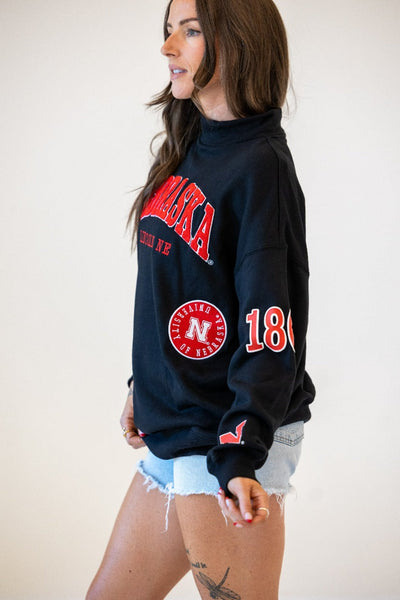 Nebraska All Over Scatter Oversized Funnel Neck